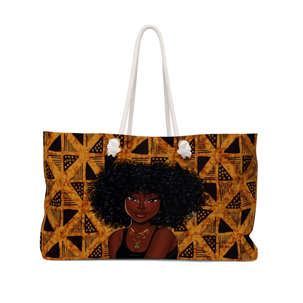 Beautiful African American Woman with curly afro on a brown and black weekender bag