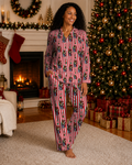 Woman wearing Holiday Harmony Black Christmas pajamas by Mah Melanin